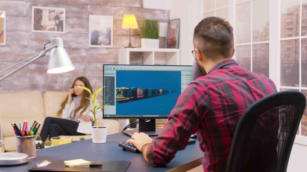 Graphic designer creating precise clipping path edits on computer in a bright, cozy office with plants and lighting